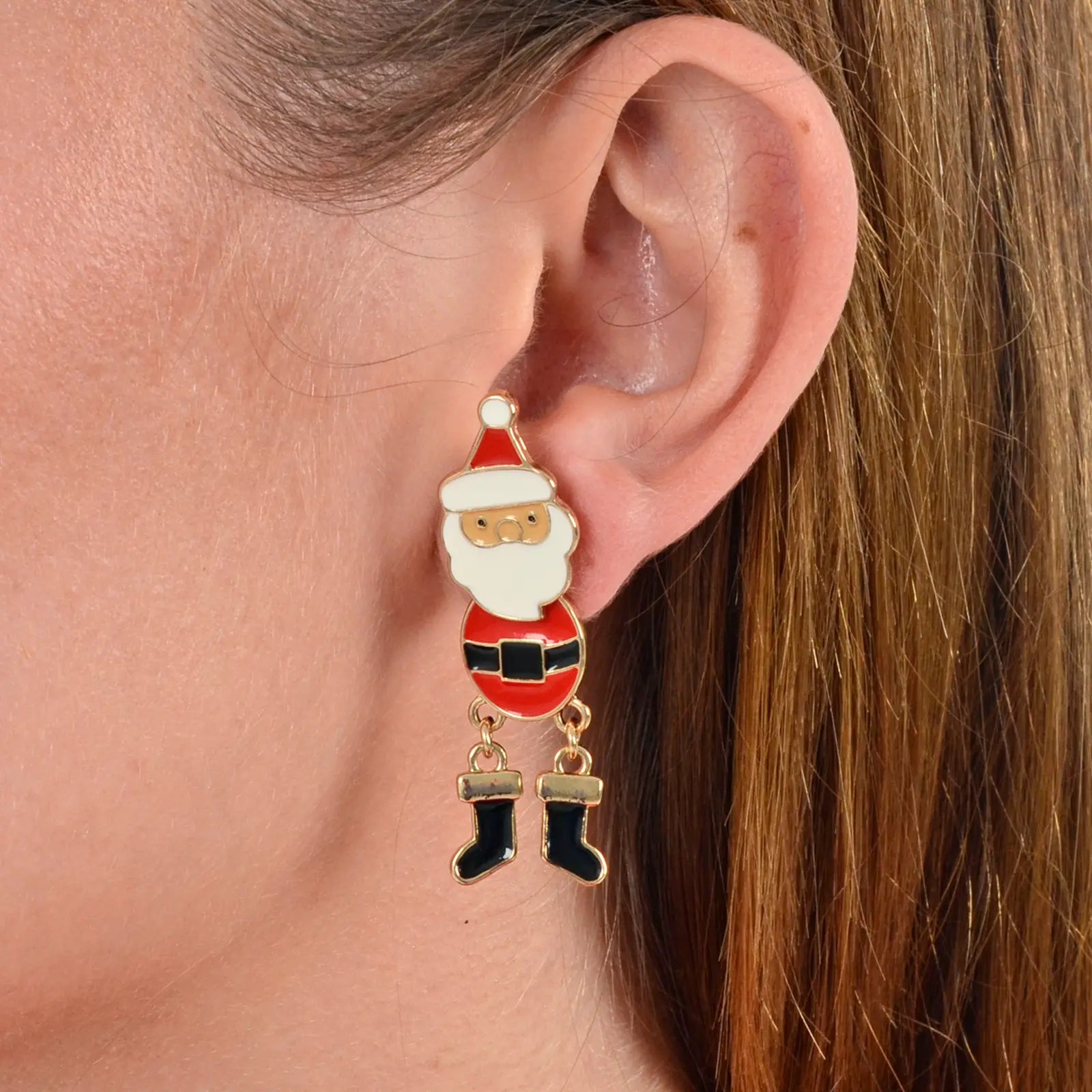model wears santa claus earrings in red white and black with moving legs